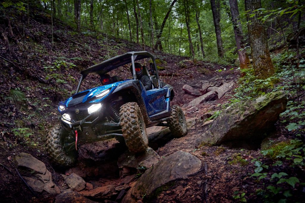 Yamaha Wolverine RMAX on a wooded off-road trail